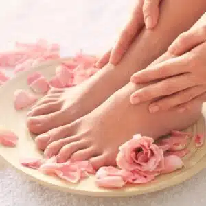 feet and rose pedals on plate nail salon cape coral